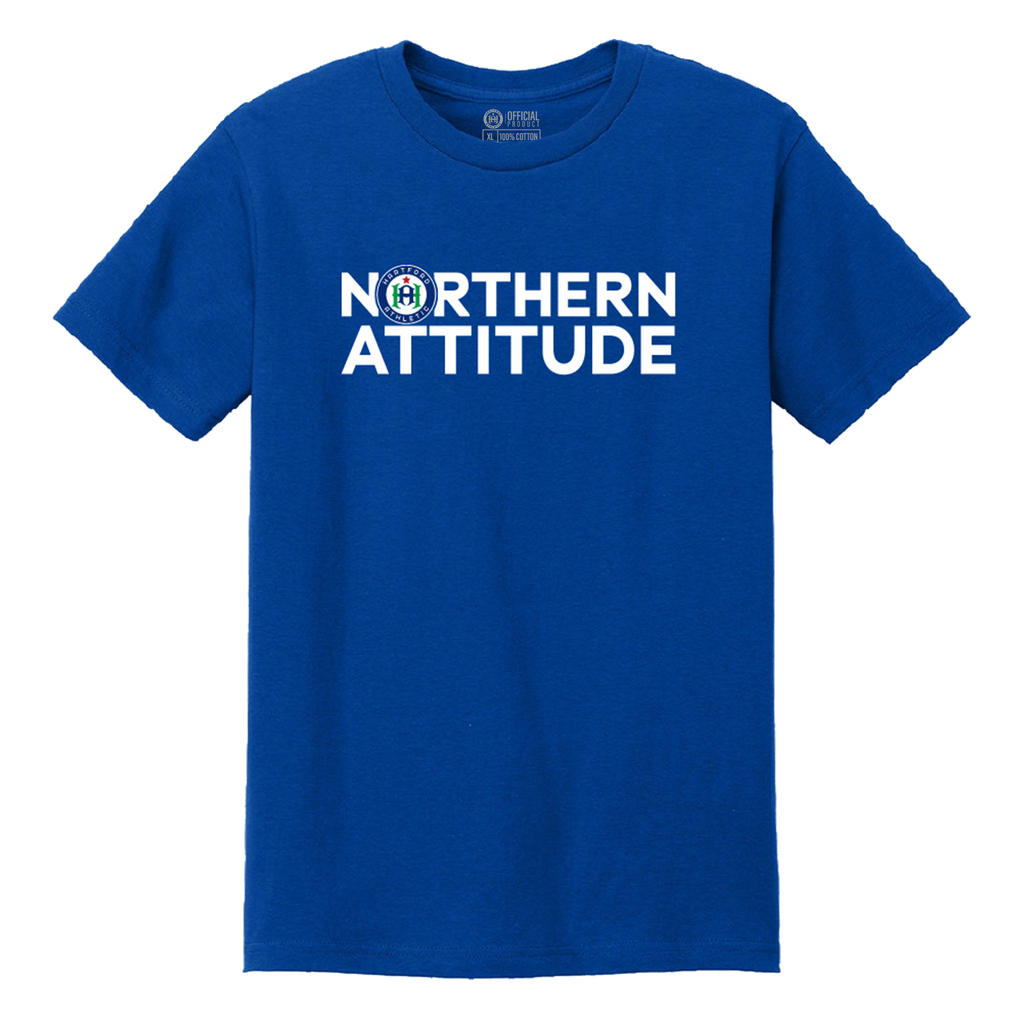 A royal blue short-sleeve crewneck t-shirt with 'NORTHERN ATTITUDE' printed in bold white letters across the chest, featuring a circular seal with an 'H' in the center of the word 'NORTHERN'.